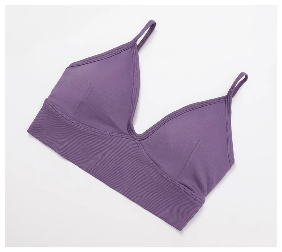 Women's seamless yoga set with sports bra, zip-up jacket, biker shorts, and leggings made from moisture-wicking four-way stretch fabric-actual close up