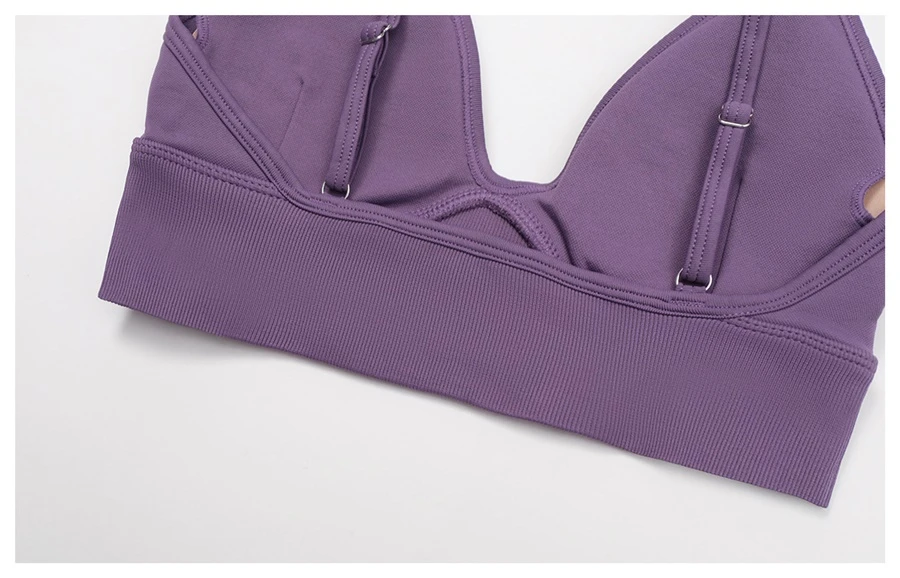 Women's seamless yoga set with sports bra, zip-up jacket, biker shorts, and leggings made from moisture-wicking four-way stretch fabric-actual close up