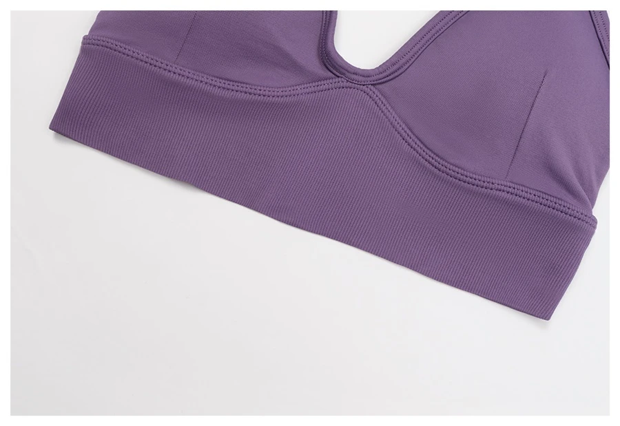 Women's seamless yoga set with sports bra, zip-up jacket, biker shorts, and leggings made from moisture-wicking four-way stretch fabric-actual close up