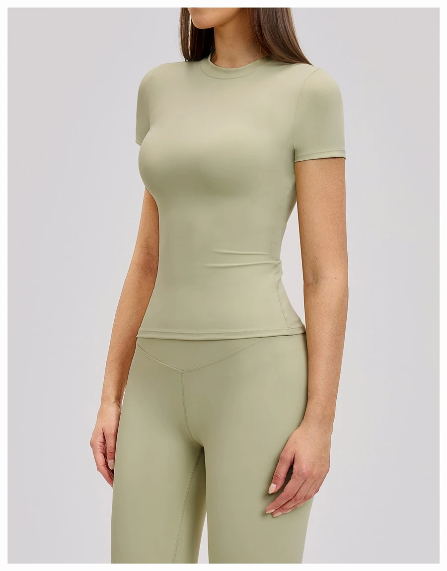 Women’s quick-dry yoga short sleeve tee in brushed nylon-spandex, slim-fit activewear top with classic crew neck and extended hem-green-side view
