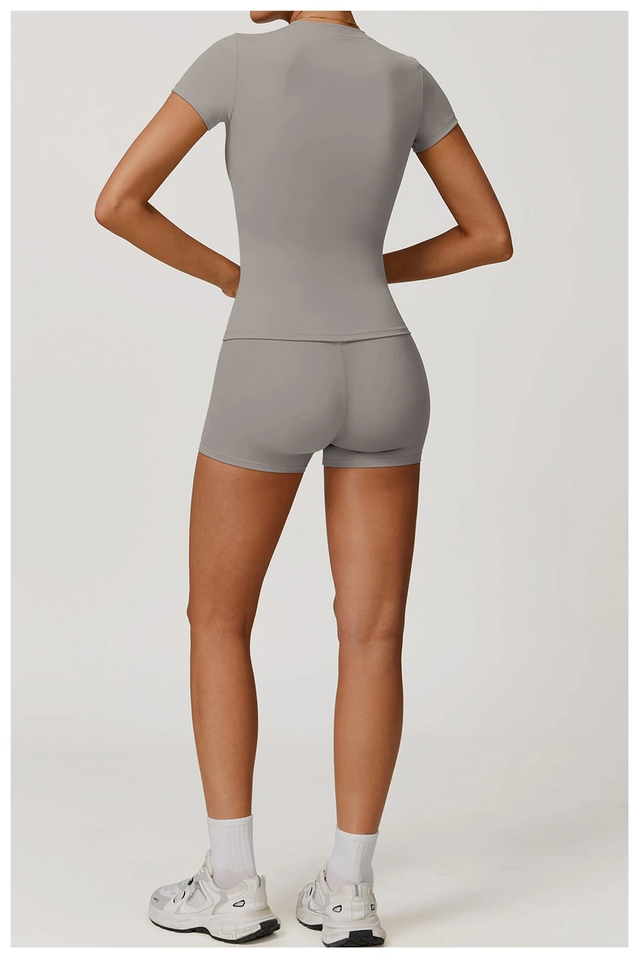Women’s quick-dry yoga short sleeve tee in brushed nylon-spandex, slim-fit activewear top with classic crew neck and extended hem-gray back