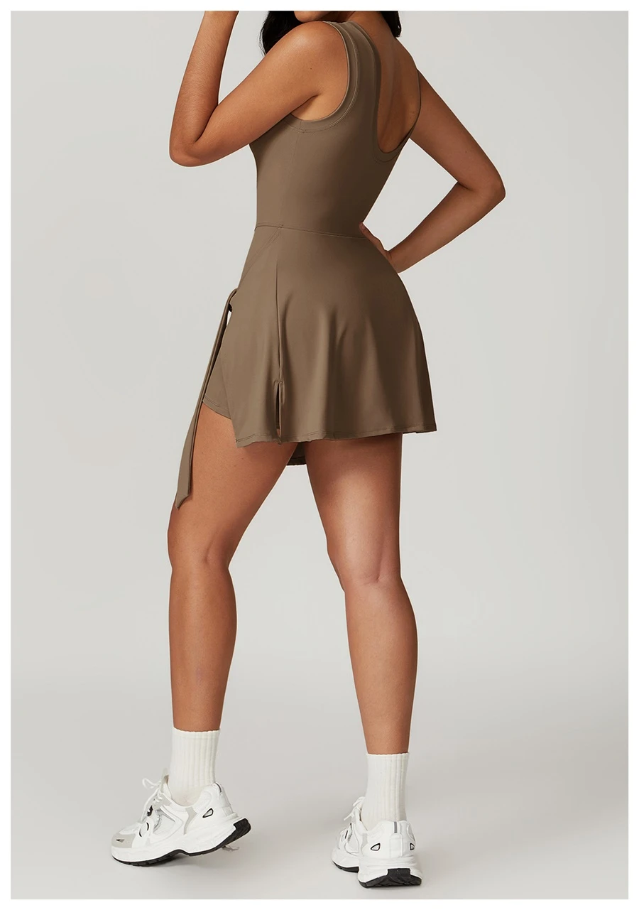 Back view of women's open back sports dress showcasing U-shaped cut-out and butterfly bone accentuation