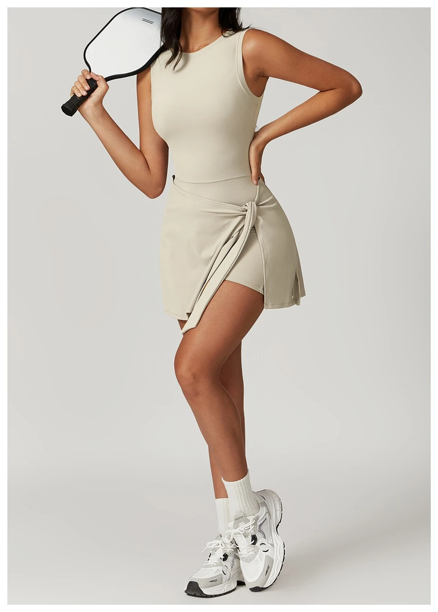 Side view of tennis dress highlighting adjustable cross-tie detail at the side slit