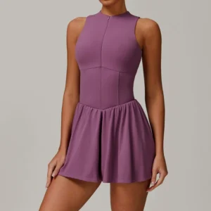 2-in-1 A-line tennis dress for women in black, featuring half-zip mock neck and flattering A-line silhouette