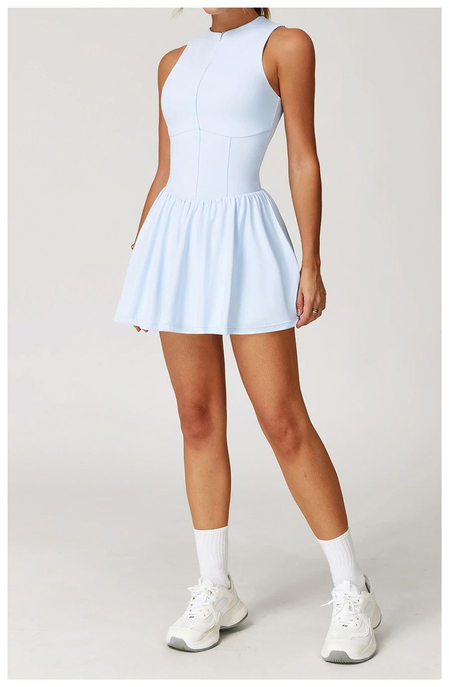 2-in-1 A-line tennis dress for women in sky blue, featuring half-zip mock neck and flattering A-line silhouette