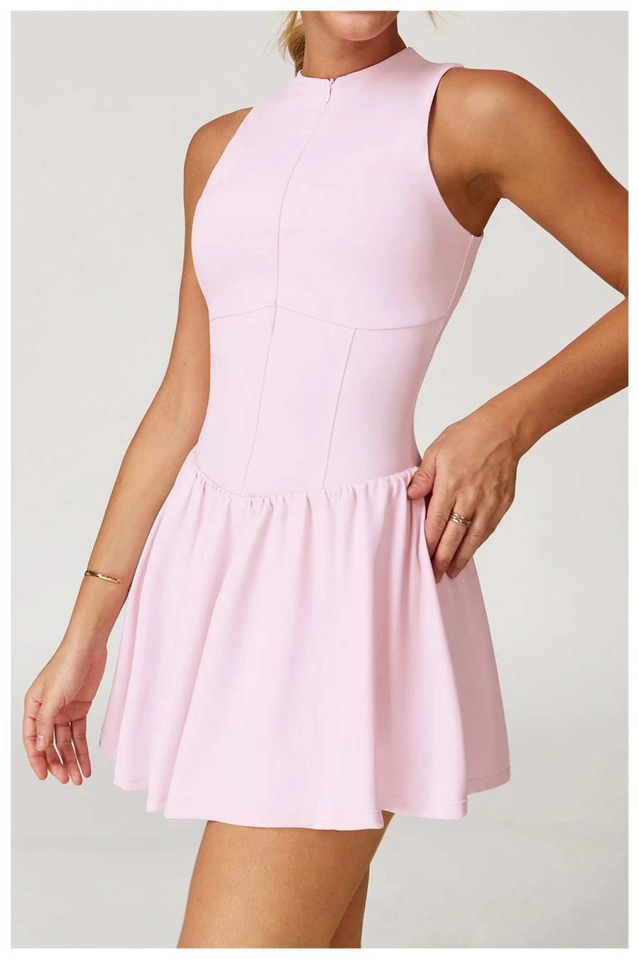 Side view of tennis dress highlighting A-line skirt's slimming effect and length