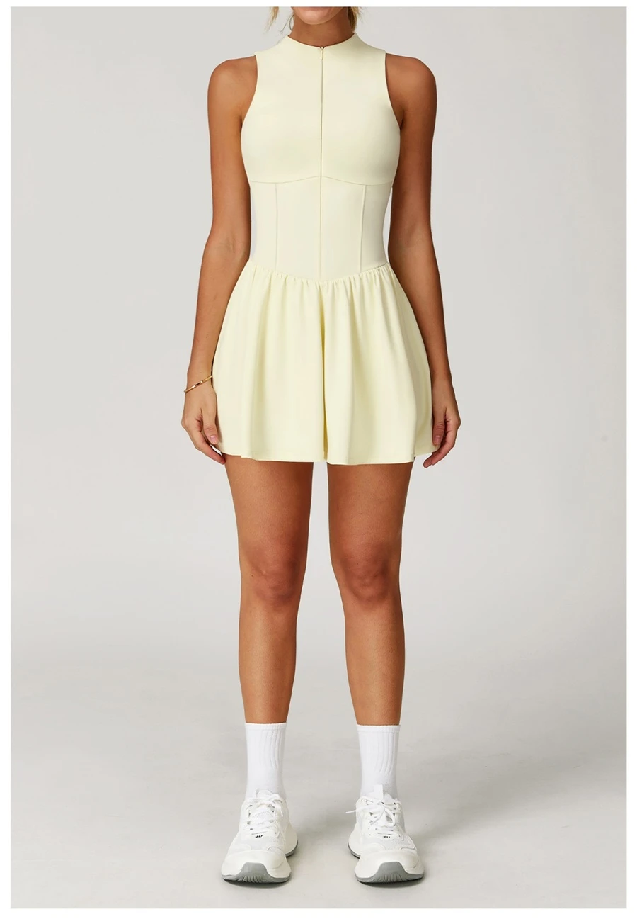 2-in-1 A-line tennis dress for women in cream yellow, featuring half-zip mock neck and flattering A-line silhouette