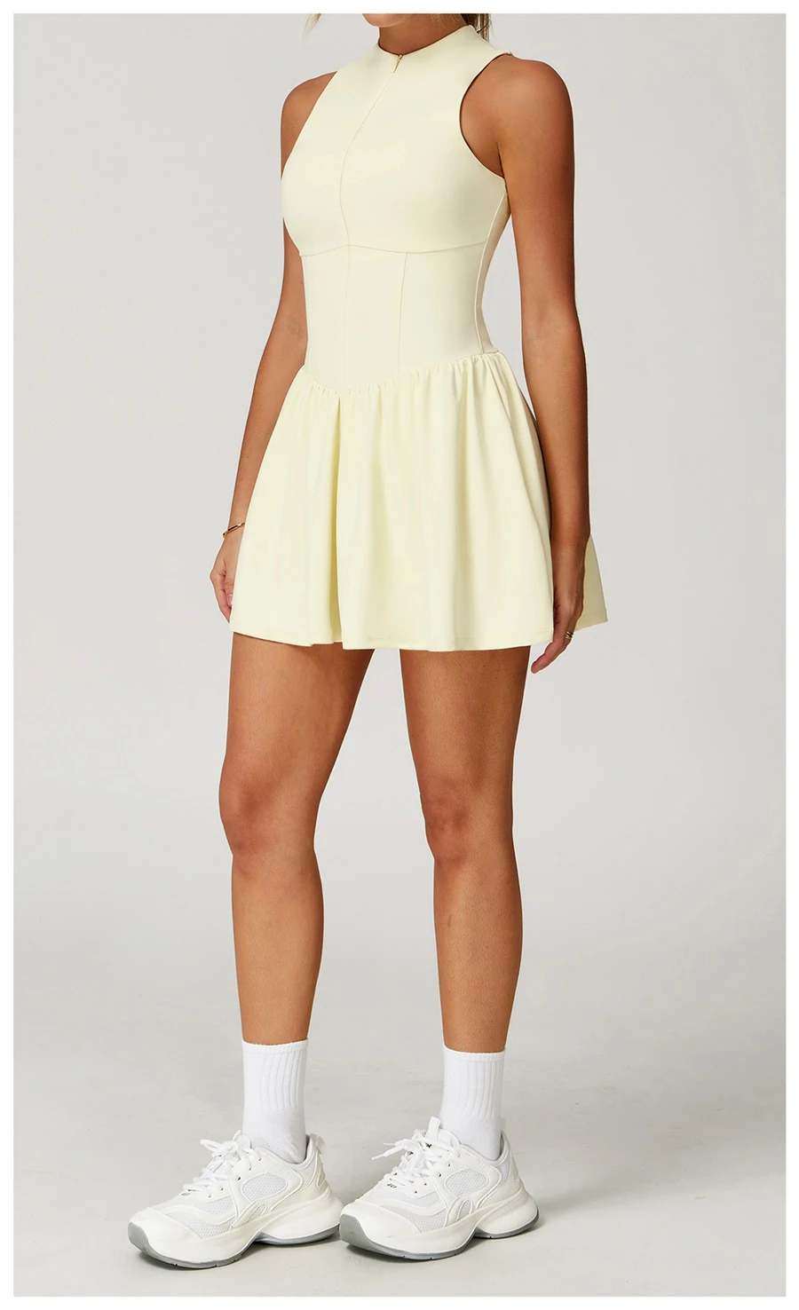 side view of the tennis dress in cream yellow 