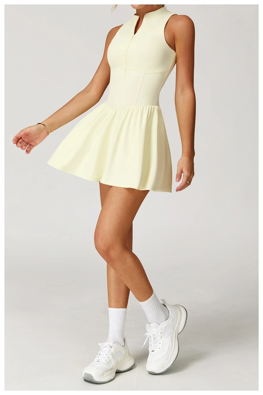 Side view of tennis dress highlighting A-line skirt's slimming effect and length
