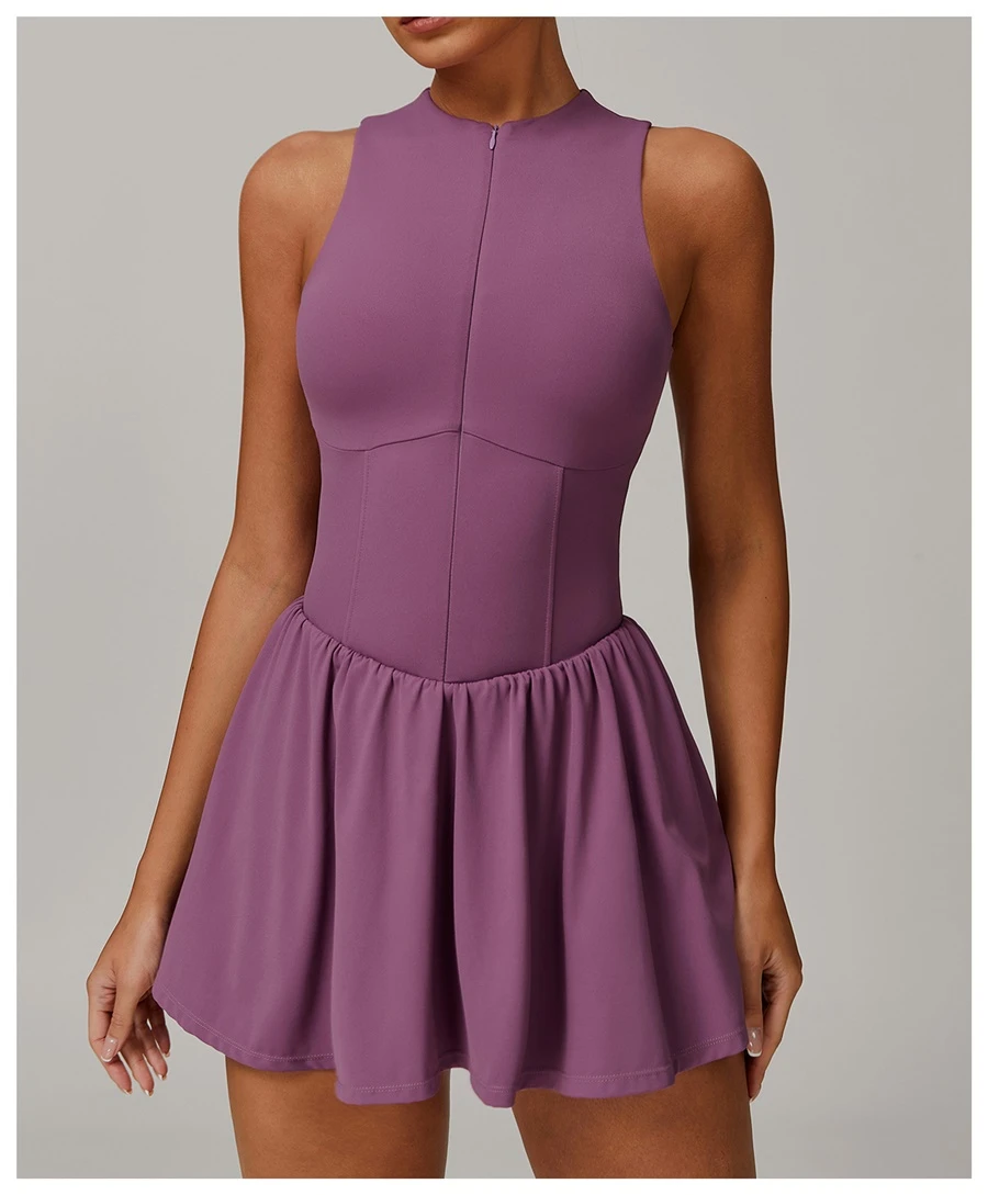 2-in-1 A-line tennis dress for women in plum, featuring half-zip mock neck and flattering A-line silhouette