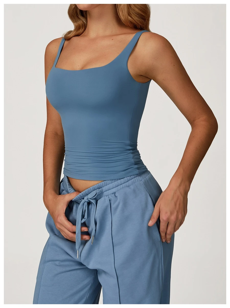 Women’s U-back quick-dry yoga tank top – square neck front view with sculpted open back, fitted tummy-control hem, in brushed nylon-spandex fabric denim blue side view