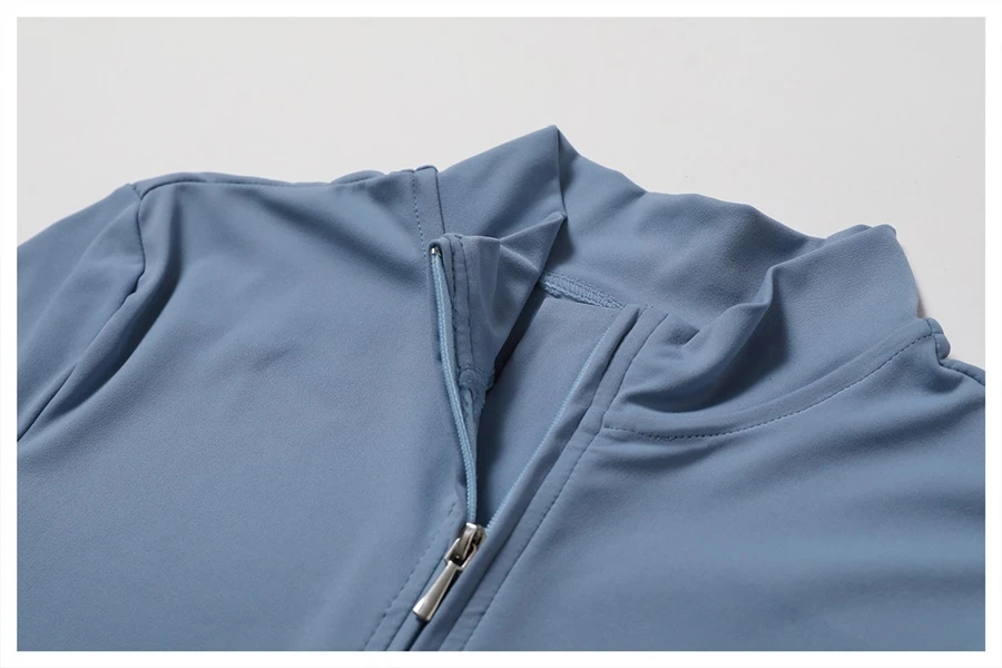 Close-up of front zipper on short sleeve yoga bodysuit – easy on/off design for workout convenience