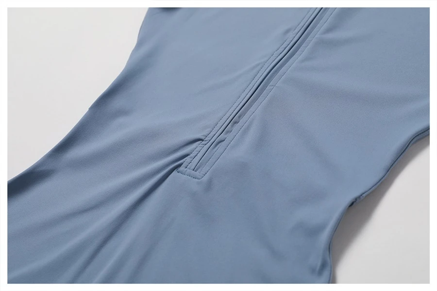 Close-up of front zipper on short sleeve yoga bodysuit – easy on/off design for workout convenience