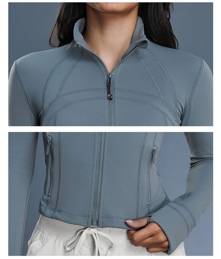 Women's zip up sports jacket with thumb hole cuffs and zipper pockets