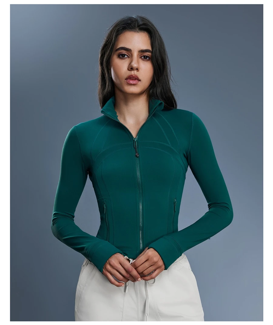 Women's zip up sports jacket with thumb hole cuffs and zipper pockets