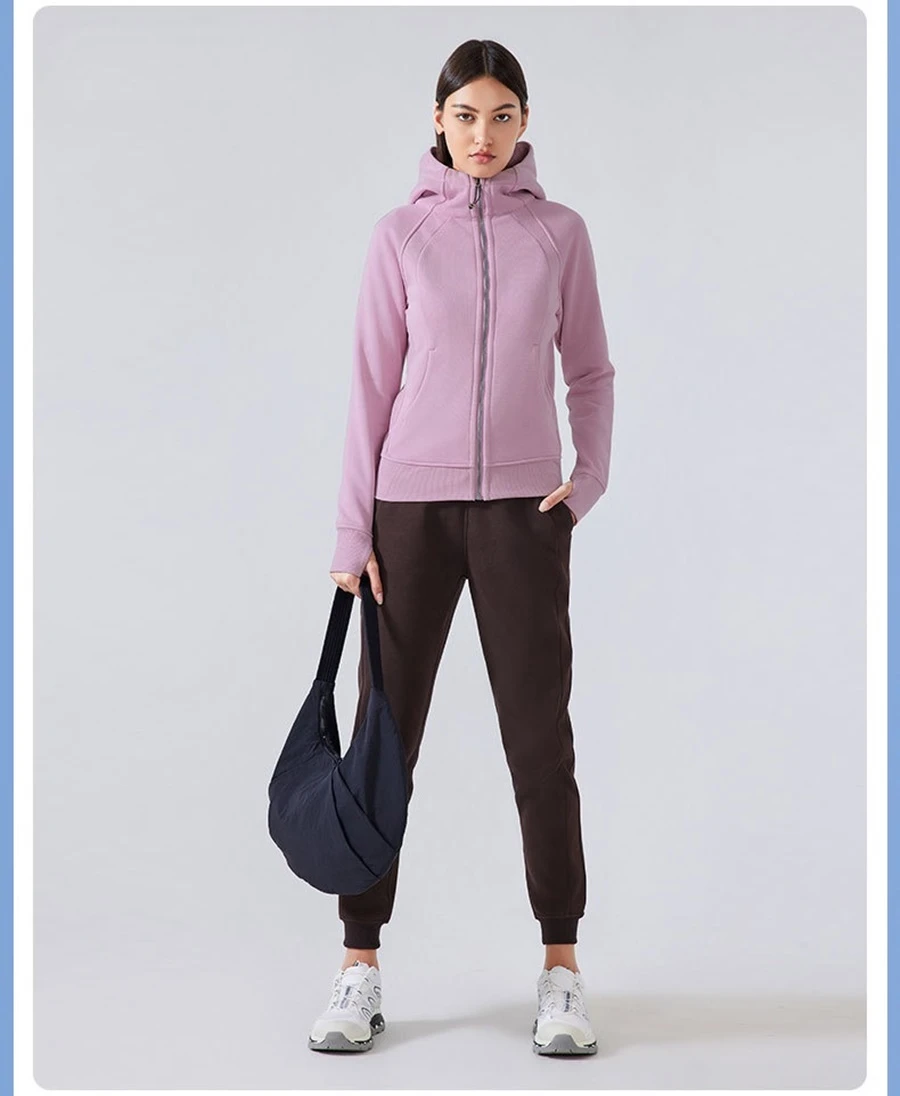 Women's fleece workout jacket with thumb hole cuffs and angled pockets