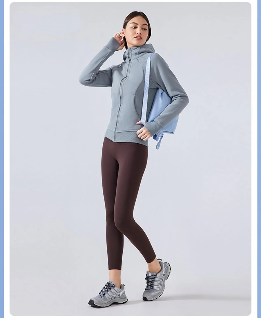 Women's fleece workout jacket with thumb hole cuffs and angled pockets