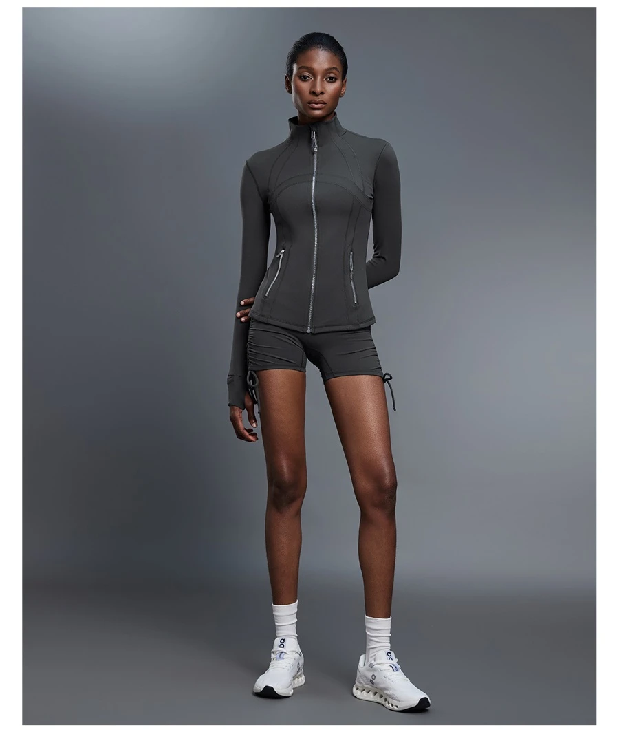 Fitted activewear jacket with thumb hole cuffs and zipper pockets-gray