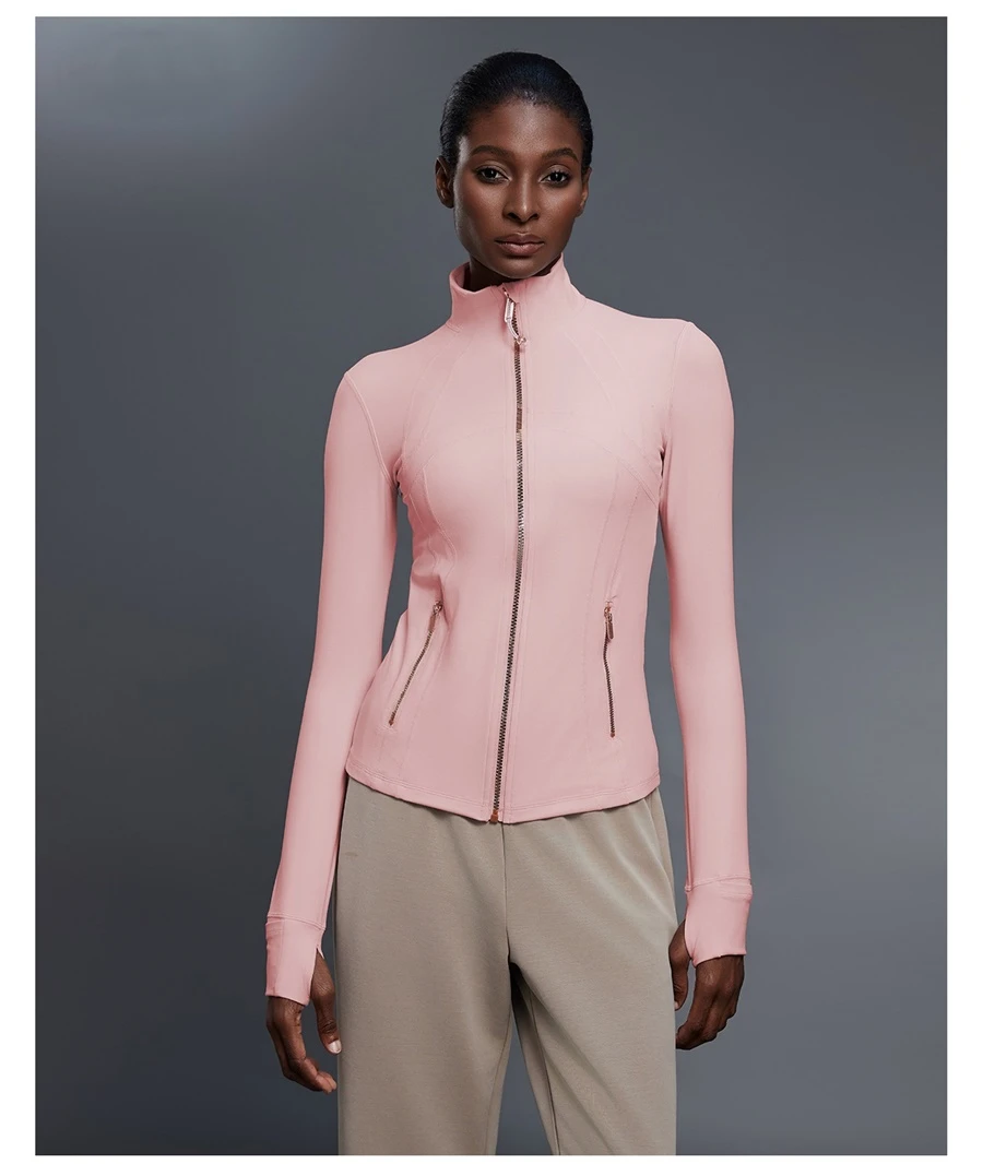 Fitted activewear jacket with thumb hole cuffs and zipper pockets-pink