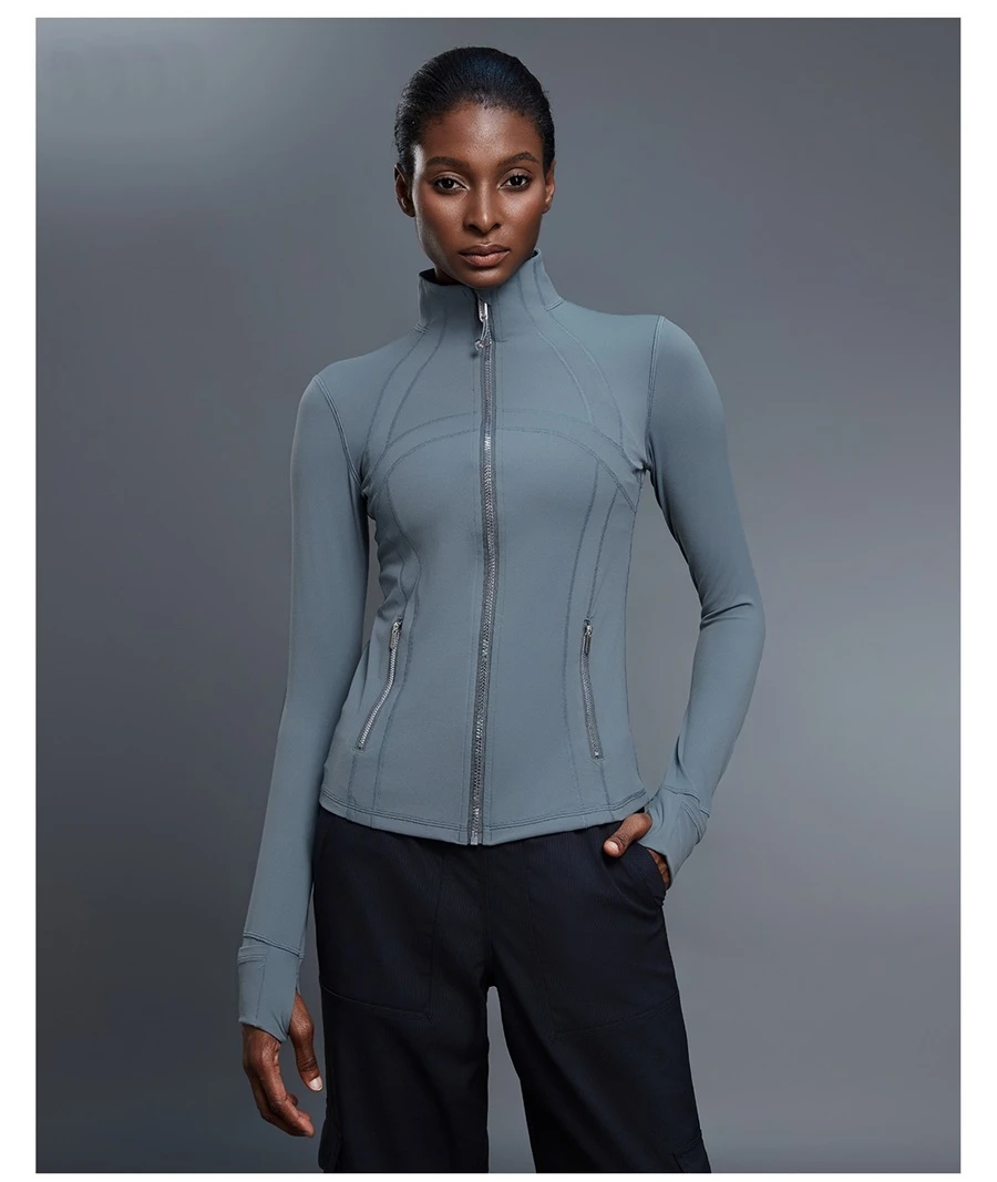 Fitted activewear jacket with thumb hole cuffs and zipper pockets-blue