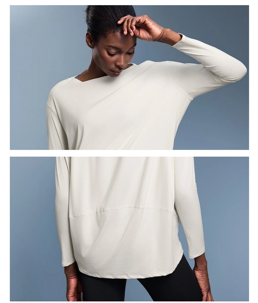 Relaxed fit yoga top with front short back long curved hem design-white