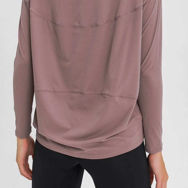 Women's loose fit long sleeve yoga top with brushed fabric for workout and yoga