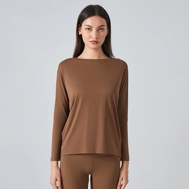 Women's loose fit long sleeve yoga top with brushed fabric for workout and yoga